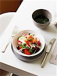 Plate of horiatiki salad with prawns