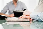 Woman with hands on paperwork, close up