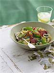 Bowl of orecchiette with peas and ham