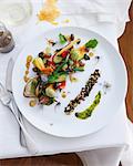 Plate of salad with zucchini, green beans, eggplant and balsamic vinegar