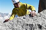 Mountaineer reaching summit, Chamonix, Haute Savoie, France