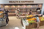 View of people grocery shopping in health food store