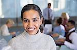 Portrait smiling businesswoman in conference room meeting