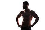 Silhouette of young athlete bodybuilder man isolated over white background
