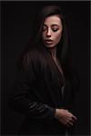 portrait young elegant woman wearind black jacket. Fashion studio shot.