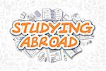 Studying Abroad - Sketch Business Illustration. Orange Hand Drawn Word Studying Abroad Surrounded by Stationery. Doodle Design Elements.