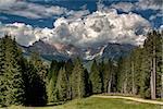 Summer landscape in the italian alps with clouds over the Odle mountains, Dolomiti - Trentino-Alto Adige