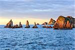 Sharp islets near Gueirua beach (Asturias, Spain). Evening Atlantic ocean landscape.