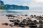 Sharp stones on the sandy beach of the beach in Thailand