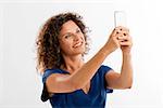 Beautiful woman with a mobile phone making a selfie