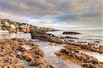 Sunset over the rocks at Pearl Street Beach in Laguna Beach, California, USA