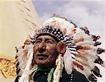 1960s NATIVE AMERICAN INDIAN MAN CHIEF GULL WEARING FEATHER BONNET MORLEY STONEY SIOUX FIRST NATIONS RESERVATION ALBERTA CANADA