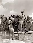 1930s 1940s 2 WOMEN BATHING SUIT SWIM WEAR FASHION STANDING TROPICAL POOL SIDE CORAL GABLES FLORIDA USA