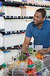 customer pushing a shopping trolley