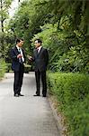 Chinese businessmen in a park