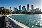 Seawall at Farm Cove with skyline and harbour on a sunny day in Sydney, Australia