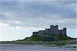 Bamburgh Castle and beach in Bamburgh in Northumberland, England, United Kingdom