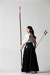 Japanese traditional archery athlete against white background