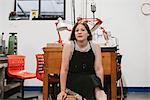 Portrait of female jeweller in jewellery workshop