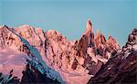 Pink sunset view of Cerro Torre and Fitz Roy mountain ranges Los Glaciares National Park, Patagonia, Argentina