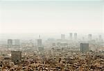 Elevated hazy cityscape view with skyscrapers, Barcelona, Spain