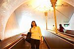 Woman on escalator, Lisbon, Portugal