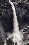 Waterfall flowing and splashing over rock face, Queulat National Park, Chile