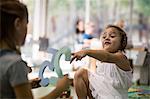 Children playing with number cutouts