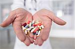 Cropped view of doctor holding pills