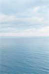 View from the land over the ocean, to the horizon. Open space, seascape and skyscape.