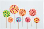 Lollipop candy caramel on sticks on white. Food background. Copy space