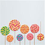 Think differ concept. Lollipop sweet caramel candy copy space white background colorful birthday party square. Lay flat top view
