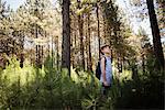 Boy hiking in woods