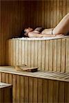 Woman relaxing in sauna