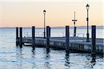 Pier on Lake Garda (Lago di Garda) at dusk in Garda in Veneto, Italy