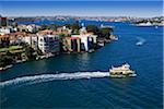 Ferry boat leaving shore in Sydney Harbour on a sunny day in Sydney, Australia