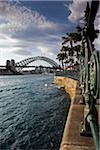 Circular Quay promenade at Sydney Cove with the Sydney Harbour Bridge in the background in Sydney, Australia