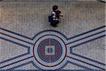 Person walking on the mosaic tiled floor in the Queen Victoria Building in the Central Business District of Sydney, Australia