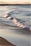 Close-up of pastel waves hitting shoreline on beach at Byron Bayin New South Wales, Australia