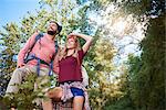 Low angle view of couple hiking, looking away, Krakow, Malopolskie, Poland, Europe