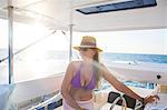 Woman relaxing on yacht, Krabi, Thailand, Asia