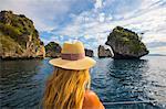 Rear view of woman looking away at view, Koh Li Ma, Thailand, Asia