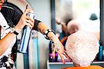 Woman working in quirky hair salon