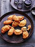 Deep fried calzone on serving plate, elevated view