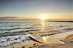 Lapping waves on beach at sunset, Odessa, Odessa Oblast, Ukraine, Europe