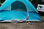 Head shot portrait of cute male toddler peeking from blue tent, Huntsville, Canada