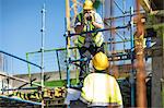 Construction workers in discussion on building site