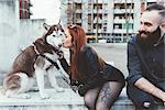 Red haired woman kissing dog