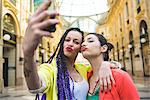 Women taking selfie in the Galleria Vittorio Emanuele II, Milan, Italy