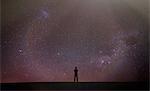 Silhouette of man looking away at starry night sky, Death Valley, California, United States, North America